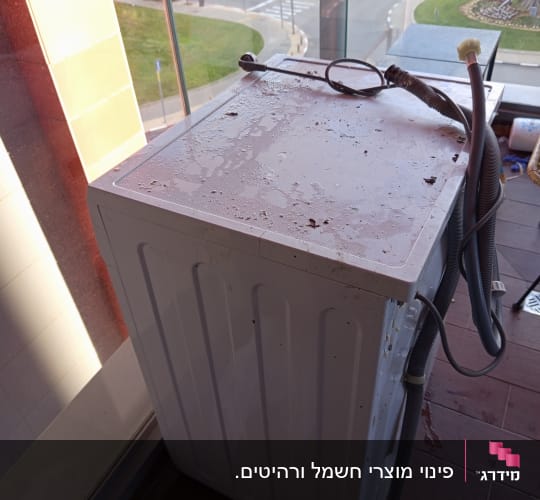 פינוי מכונת כביסה יחידה ממרפסת דירה